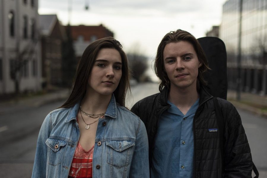 Nullhegan’s Emma Downie and Ben Collins, both juniors, stand on College street April 11.