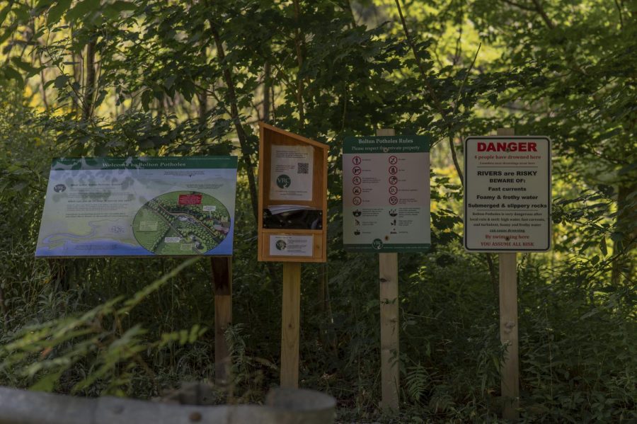 Signs warn visitors of dangerous waters at Bolton Potholes.