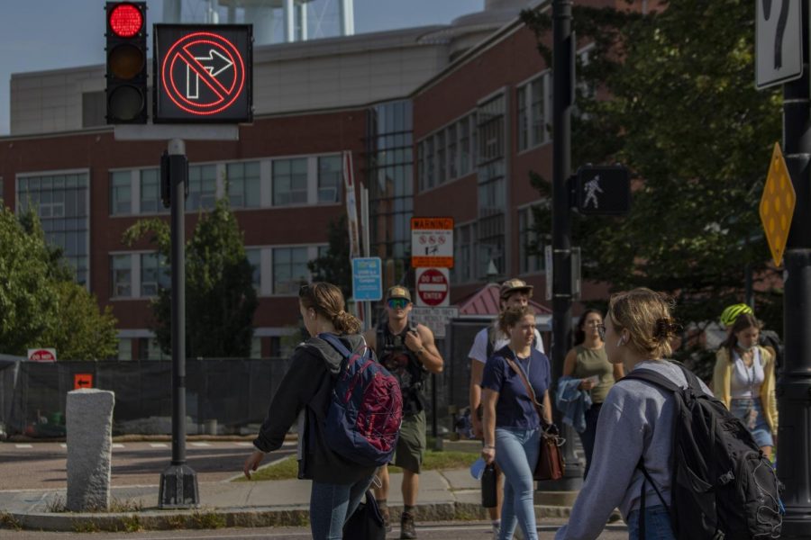 A group of students cross at the intersection on Main Street by University Heights the morning of Sept. 8. 