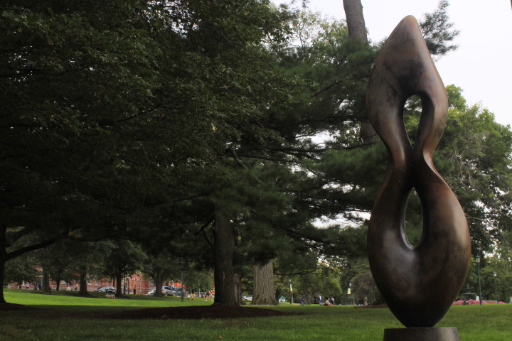 A sculpture stands on the Waterman Green.