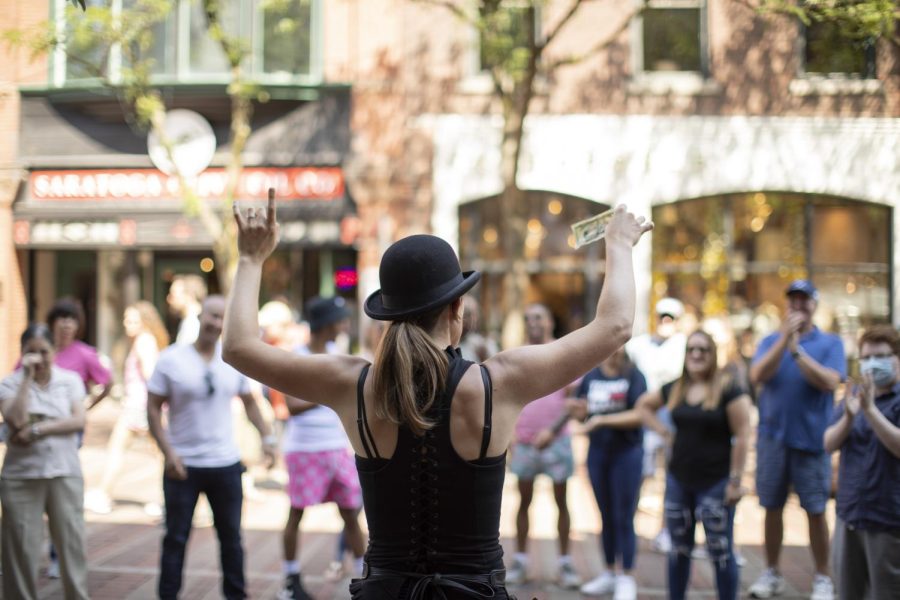 Alyx the Magician wraps up a performance on Church Street.