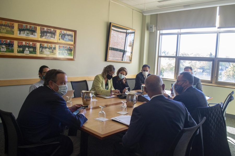 Members of the UVM Board committee sit inside the Boulder Society Room Oct. 29