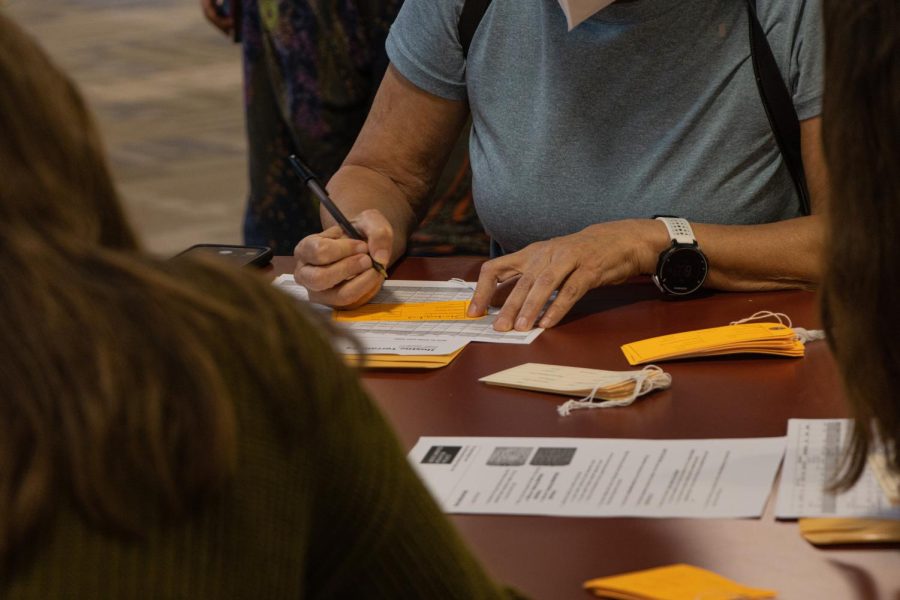 Attendees fill out tags that list names of individuals who lost their lives trying to cross into the U.S. through the Sonoran Desert on the southern border of Arizona. 