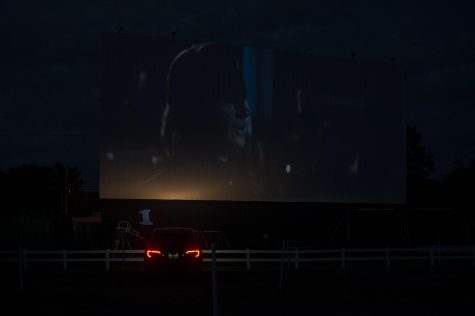 A single car parks in front of screen three at the Sunset Drive-In where The Conjuring: The Devil Made Me Do It is playing June 21.
