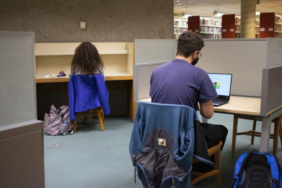 Students work at desks on the second floor of the Howe Library Nov. 19.