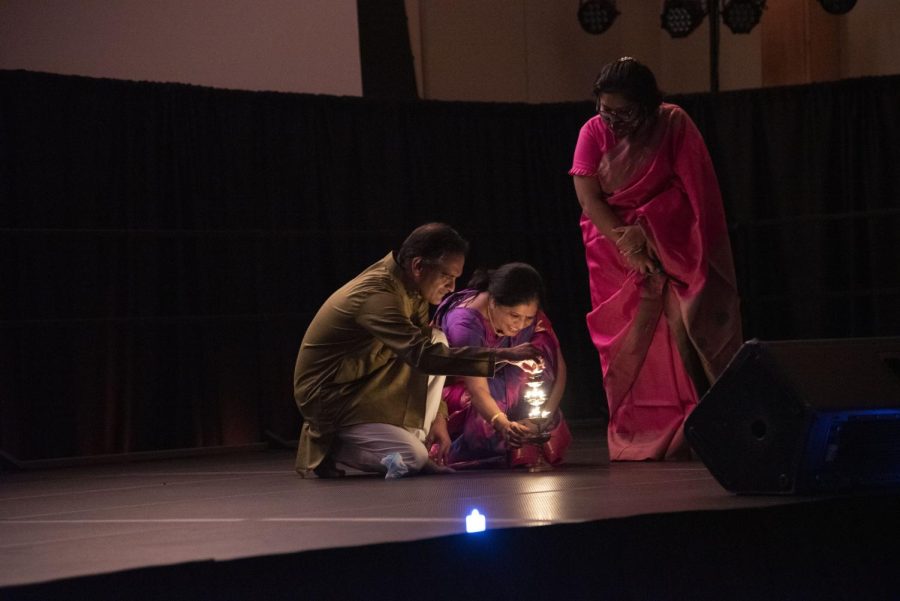 President Suresh Garimella and his wife lighting the celebratory lamps for Diwali in the Grand Maple Ballroom of the Davis Center Nov 14.