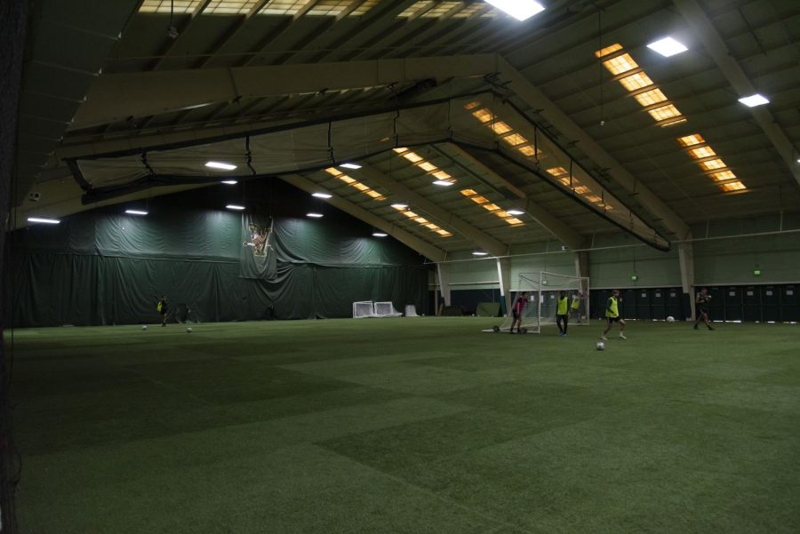 The UVM men’s soccer team conducts an afternoon practice Friday, Dec. 3 on the indoor field. 

