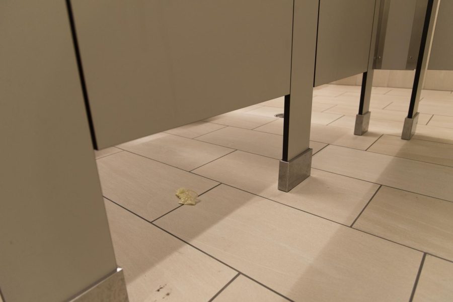 Photo Illustration: A condom is on the floor of the women’s multi stall bathroom in Innovation Hall Dec. 3.
