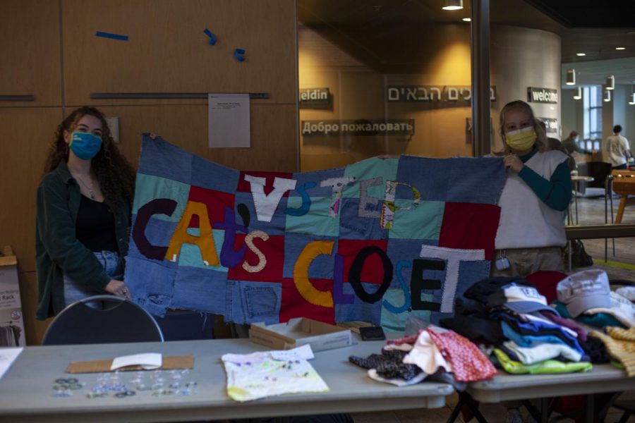 Junior Grace Kreitler and junior Casey McKay hold up a quilt in the Davis Center Dec. 3.