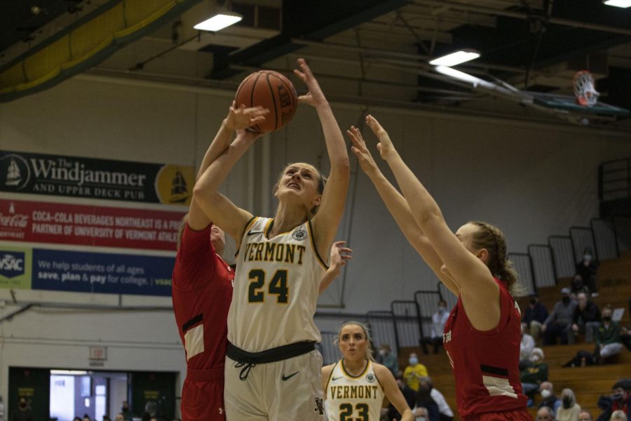 UVM+womens+basketball+defeats+Hartford+on+Jan.+21.+Sophomore+forward+Anna+Olson+fights+for+control+of+the+ball.%0A