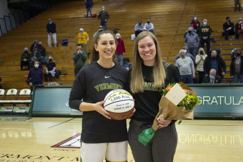  Graduate guard Josie Larkins poses with her 1,000 point award and her head coach, Alisa Kresge, on Jan. 26. Larkins scored her 1,000 point on Jan. 15 at a home game against University of Maryland, Baltimore County.
