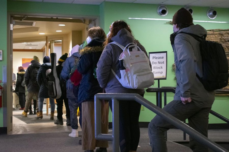 Students wait in line for their COVID-19 tests in the Davis Center on Jan. 27.
