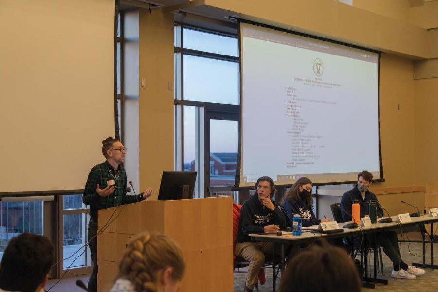 Elliot Ruggles, sexual violence prevention and education coordinator, speaks during the SGA meeting March 22.