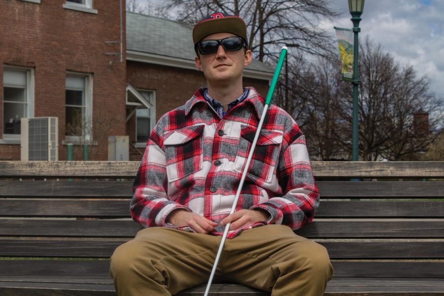 Graduate student Justin Salisbury outside of Perkins Hall April 22. Salisbury, who is blind, advocates for child custody rights for parents with disabilities. 