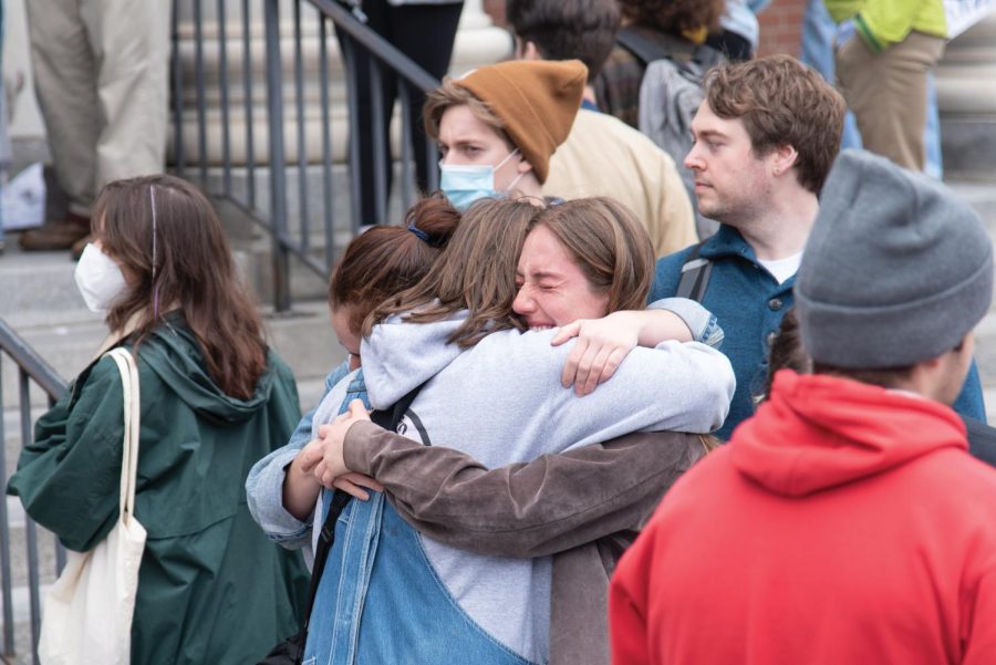 Students embrace during the walkout April 27.
