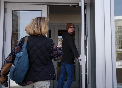 Photo Illustration: Students holding the door for each other at Innovation Hall. On the topic of door-holding, anthropology professor Luis Vivanco said “there are all kinds of interpersonal politics that go into holding the door.”