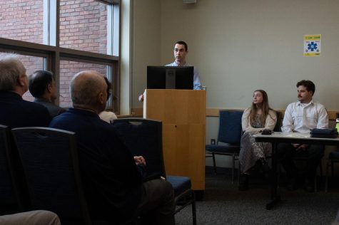 Senior Eli Racusin discusses his experiences and contributions to the Cat ECare program during a kickoff event in the Davis Center April 17.