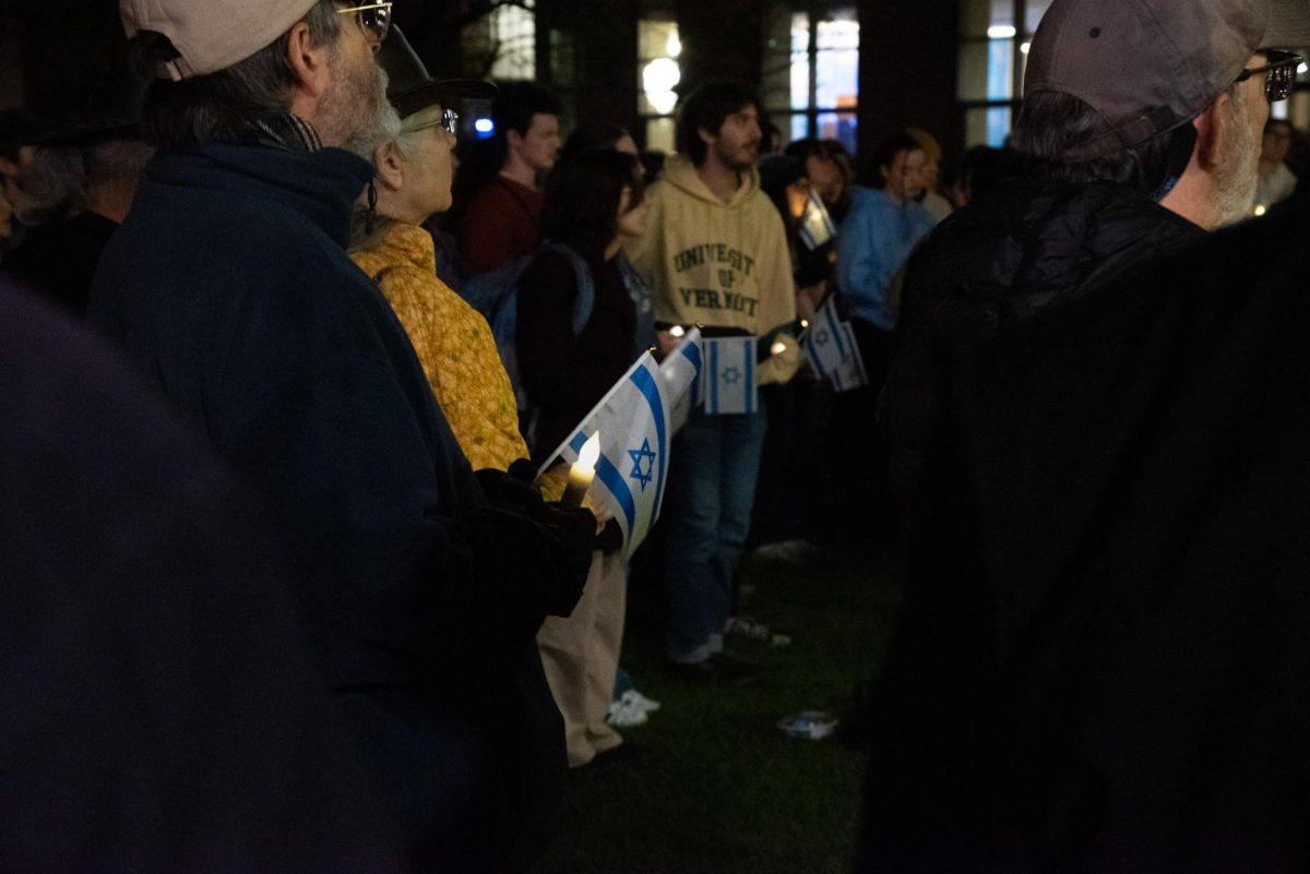 Attendees+of+Hillel%E2%80%99s+Vigil+for+Israel+held+candles+and+Israeli+flags+memorializing+those+lost+in+the+past+week+Oct.+12+