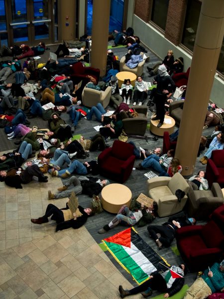 A die-in protest began in the Davis Center Atrium as students laid on the floor holding signs in support of Palestine Feb. 15.