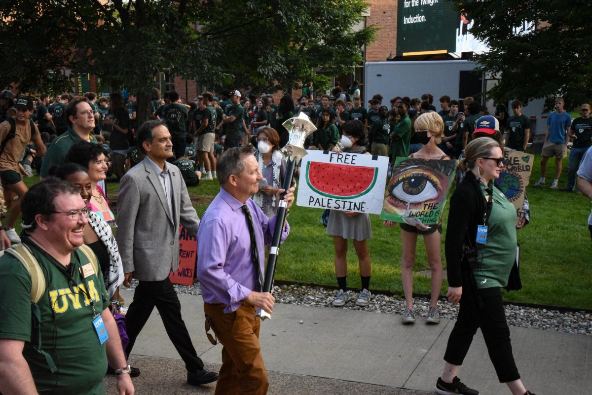 President Suresh Garimella walks past a group of protesters Aug. 25.
