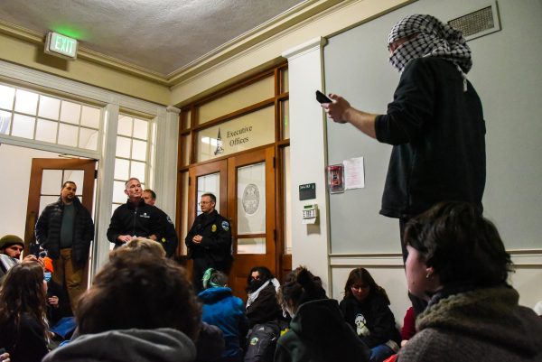 Michael Schirling, UVM chief safety and compliance officer, interacting with protesters Nov. 30 2023.