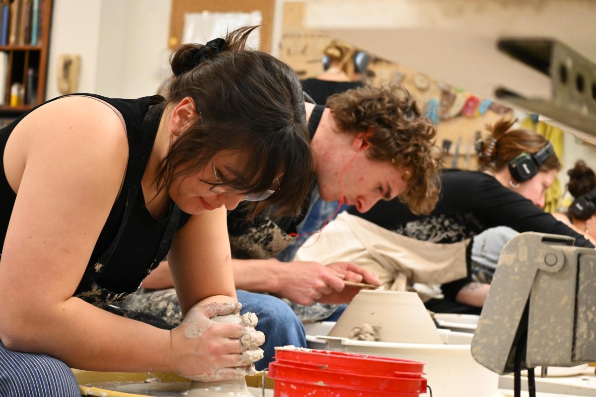  Students from the UVM ceramics co-op all work on their pieces on the wheel Feb 16. 