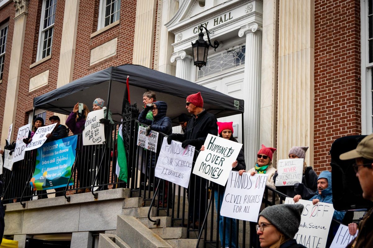 Protesters line the steps of City Hall.