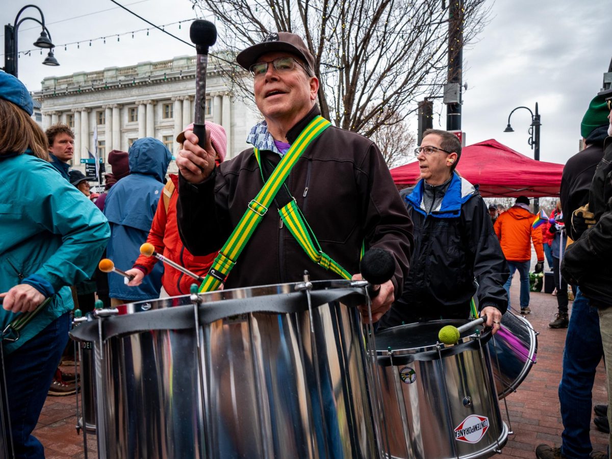 Afro-Brazilian percussion group, Sambatucada, performs at the “Hands Off!” protest.