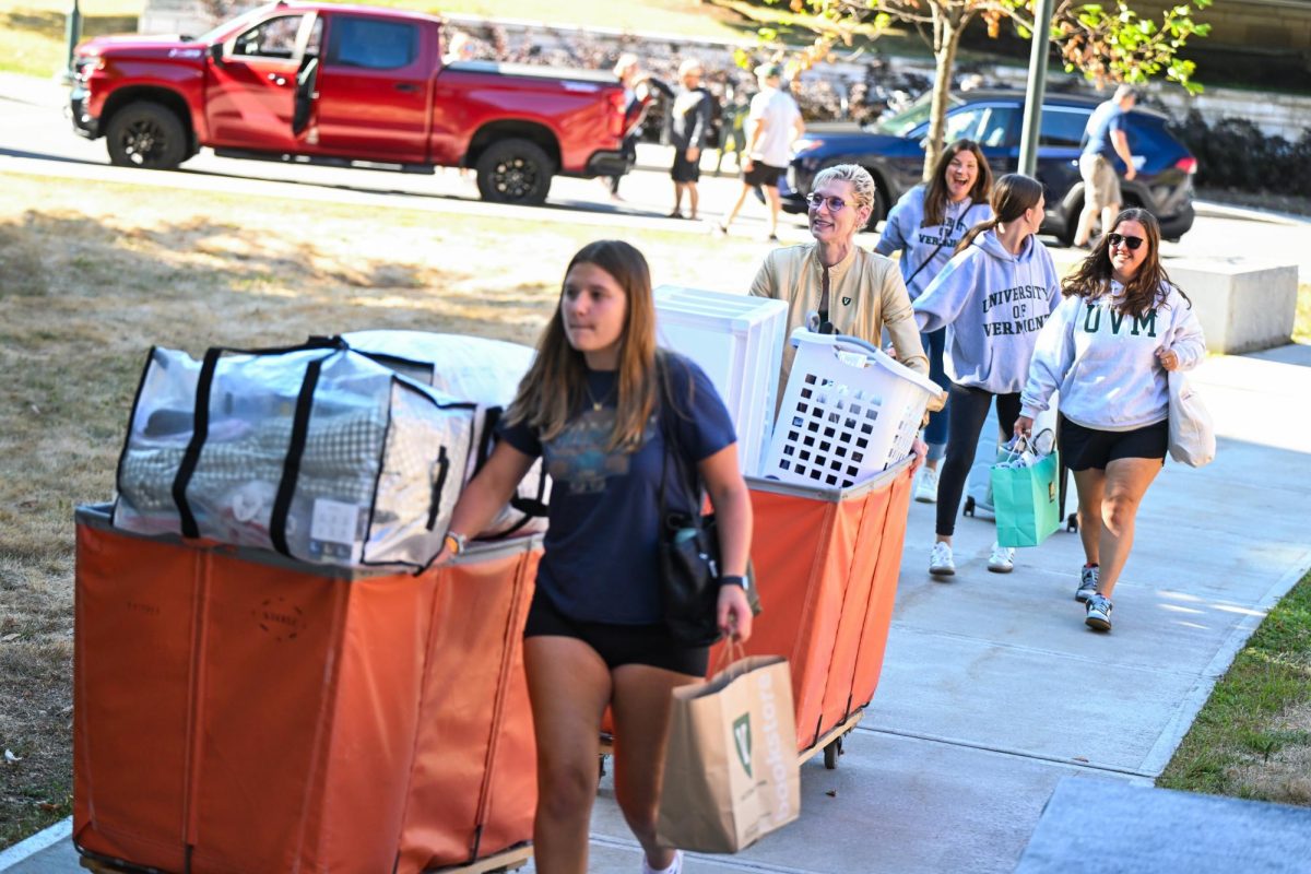 Tromp assists students with move-in day, Aug. 21.