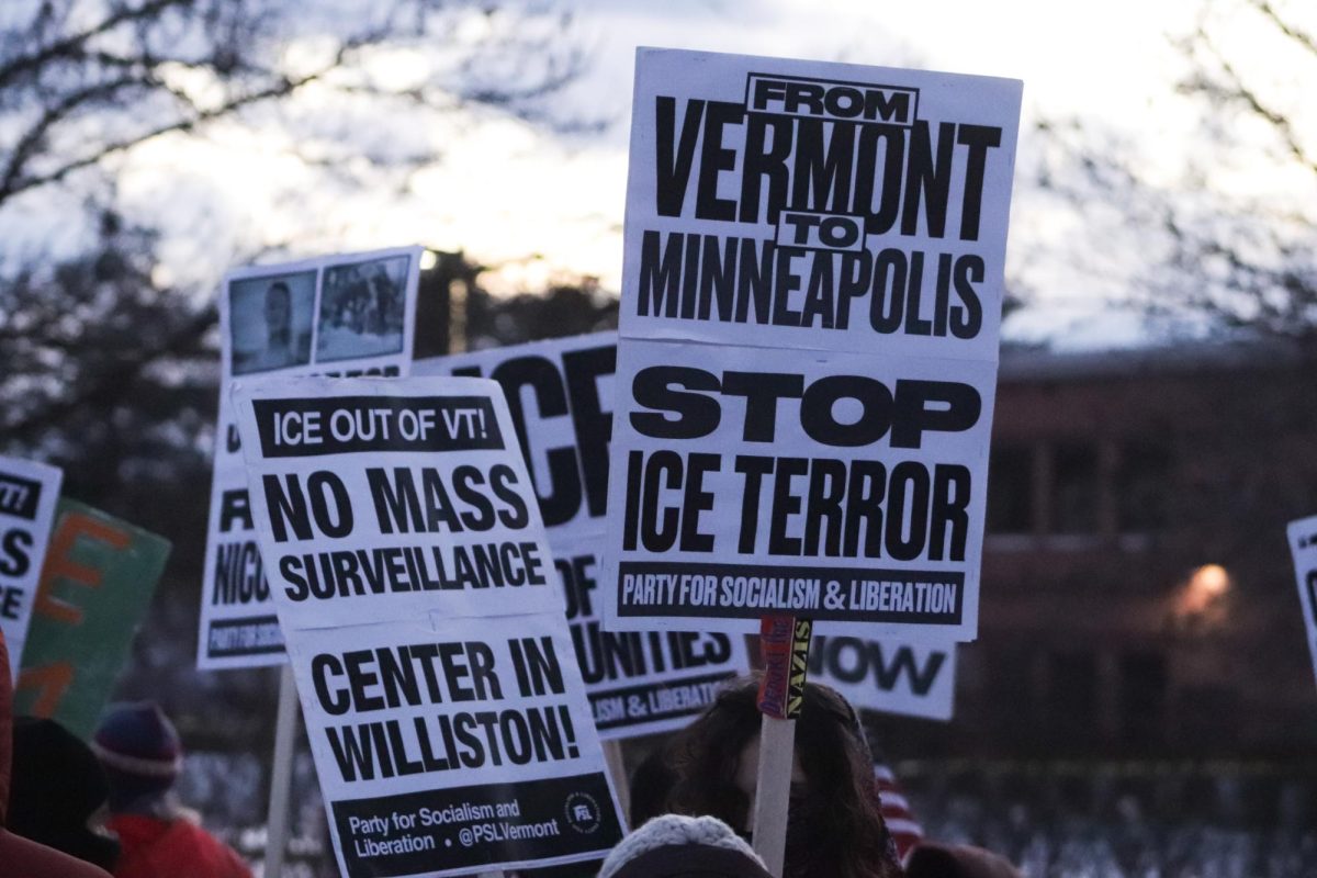 Protestors hold signs to fight against ICE.
