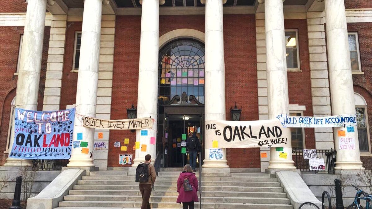 Students put up signs outside of the Waterman building for Sexual Violence Awareness Month, 2018.